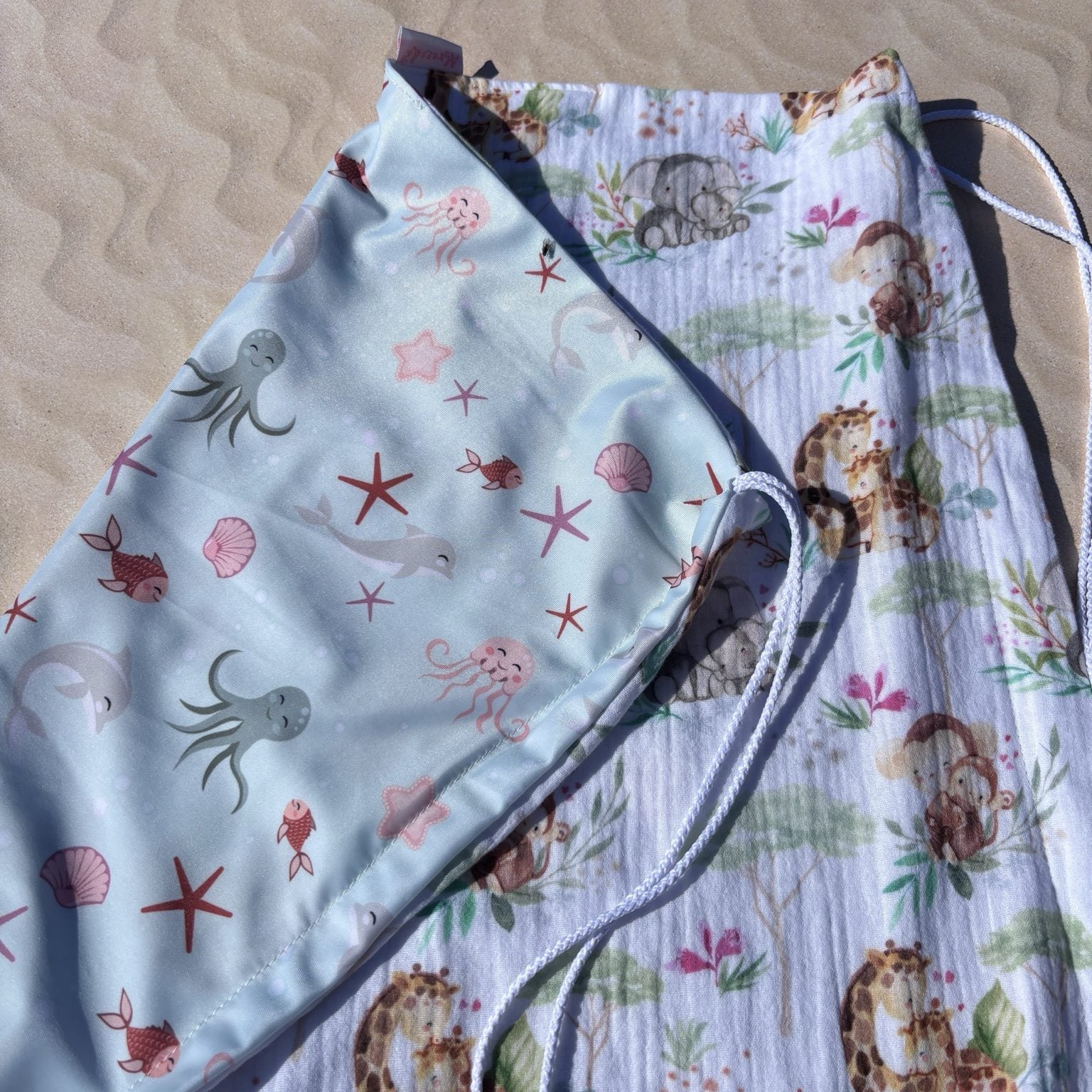 Pare-soleil poussette réversible motif océan et savane